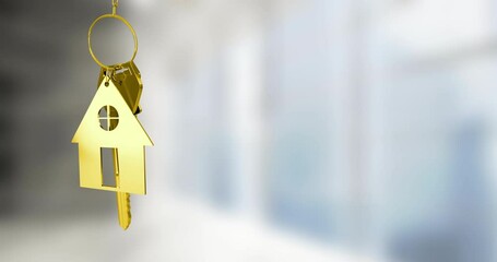 Animating golden house keychain over blurred background - Powered by Adobe