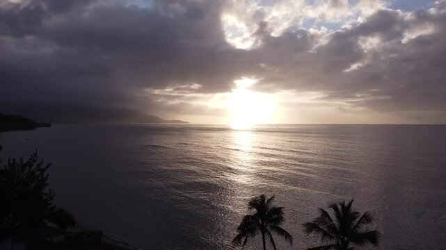 Dynamic drone footage capturing the vibrant Caribbean sunset