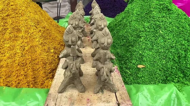 Clay idols or puppets Hastar kept in between of colorful hay or gulal for Janmasthami celebration.