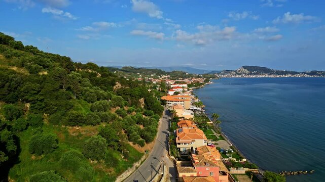 Soaring over town of Argassi, this drone video captures coastal landscape