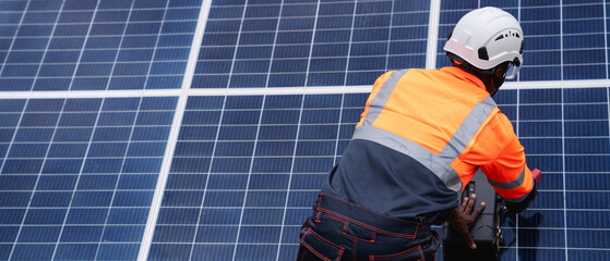 Service engineer check and maintenance solar panels in cultivation area. Clean energy concept.