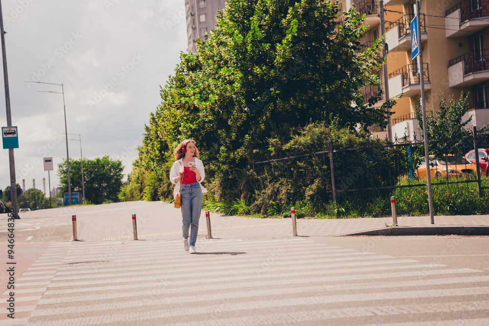 Poster Full size photo of excited dreamy lady walking cross road wear white shirt walking outside modern urban city street