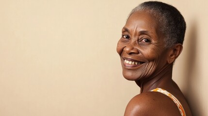 Content older woman smiles warmly at camera, elegant