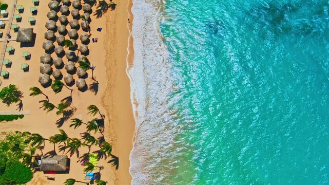 Aerial view of tranquil beach scene for travel inspiration. Summer vacation and holiday concept in tourism. Luxury seaside holiday destination. Beach landscape on ocean coast. Travel.