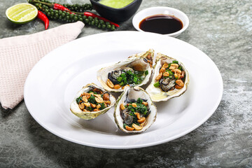 Open half oysters with green onion