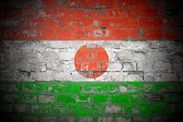 Flag of Niger on brick wall