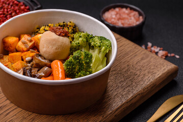 Colorful vegan vegetarian dish consists of tofu, broccoli, quinoa, mushrooms