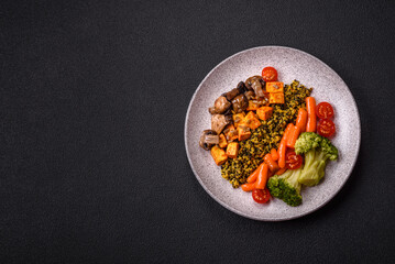 Colorful vegan vegetarian dish consists of tofu, broccoli, quinoa, mushrooms