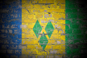 Flag of Saint Vincent and the Grenadines on brick wall