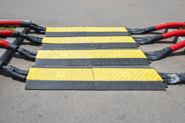 Low profile plastic cable protective cover for scene or outdoor events.