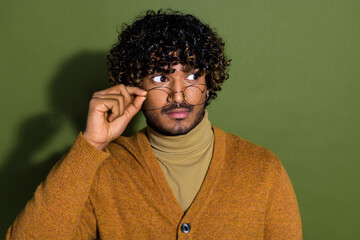 Photo portrait of handsome young guy look shocked empty space dressed stylish brown garment isolated on khaki color background