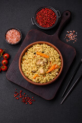 Delicious fresh pilaf with rice, carrots, meat, onions, spices and berries