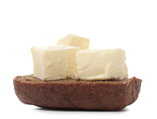 Bread with pieces of fresh butter on white background