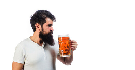 Fototapeta premium Beer for pub, bar. Bearded man in white t-shirt tasting fresh brewed beer. Handsome male with mug of delicious craft beer. Drink, alcohol and leisure. Oktoberfest festival. Copy space for advertising.