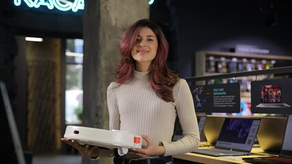 A cheerful woman explores new technology, showcasing her excitement