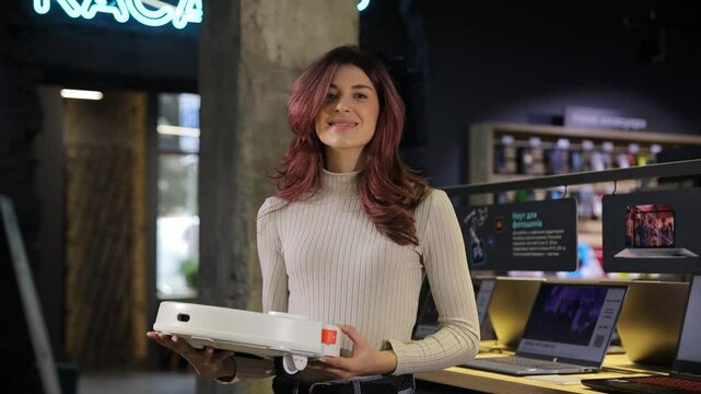 A cheerful woman explores new technology, showcasing her excitement