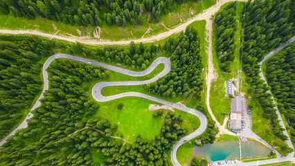 An aerial view of Terrazza delle Dolomiti and the stunning peaks of Gruppo Sassolungo, including...
