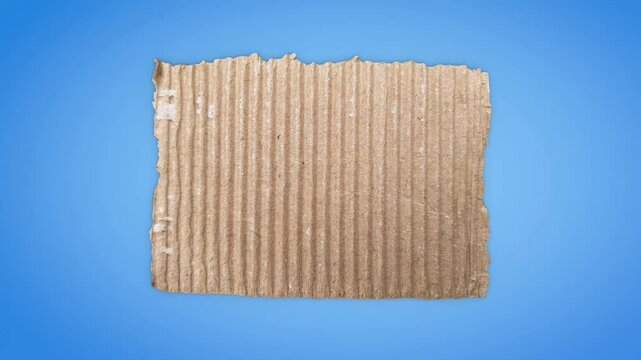Animation of corrugated cardboard cutouts on a blue background with space for text and designed with luma matte. Realistic template featuring rolled and torn paper, rendered in 3D