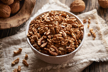 A bowl of walnuts on a table