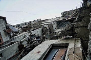 Destroyed apartment buildings due to war and shelling with rockets and artillery