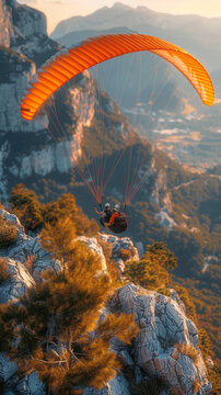 Paraglider flying over mountains