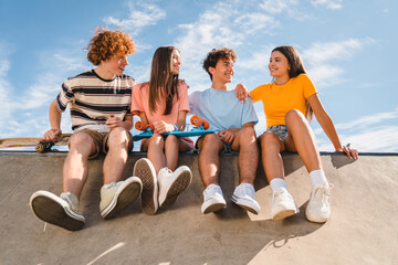 Smiling group of teenagers classmates students school pupils friends boys girls in casual meeting...