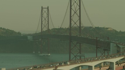 The 25 April Bridge (Ponte 25 De Abril) Located In Lisbon, Portugal, Crossi