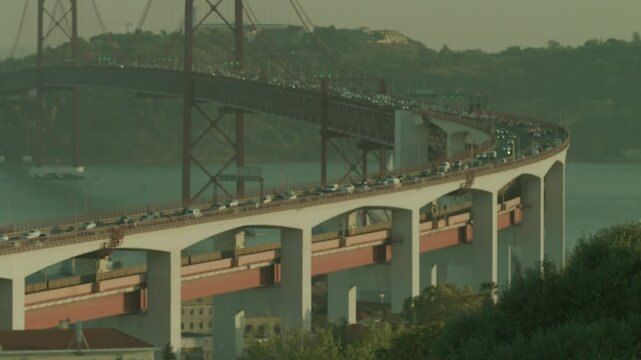 Traffic On 25 Of April Bridge At Sunset In Lisbon