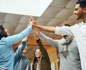 University, students and library with high five and happy from group project success with win....