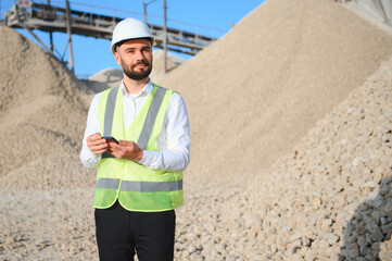 An engineer at a crushed stone or gravel plant. Stone mining