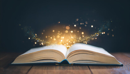 Open book with sparkles on table. Magic composition in dark room.