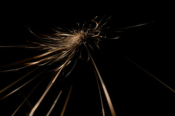 sparks from the grinder glowing in the dark