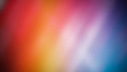Bright and colorful abstract gradient background in 4K with a blend of red, orange, yellow, pink, and blue hues featuring a grainy texture. Perfect for vibrant designs, banners, and wallpapers