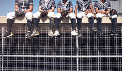 Baseball team, legs and relax for watch on dugout, athlete and practice for match on field. Wait, rest and together in uniform for male people for softball, stadium and sport in summer for workout
