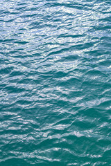 Ocean surface. Blue water texture. Close up blue water surface. Sea surface aerial view. Blue ocean surface. Blue water. Pattern texture.