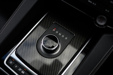 Close-Up of Automatic Gear Shift in Car Interior with Carbon Fibre Trim