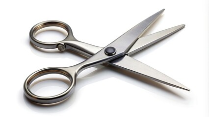 Obraz premium A pair of sharp, metallic scissors lies open with blades parted, isolated on a pure white background, casting a subtle shadow, conveying precision and utility.
