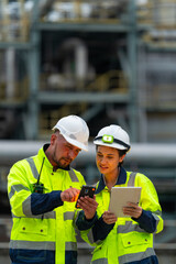 Man and woman petrochemical engineer teamwork meeting discussion at petroleum oil refinery industry...