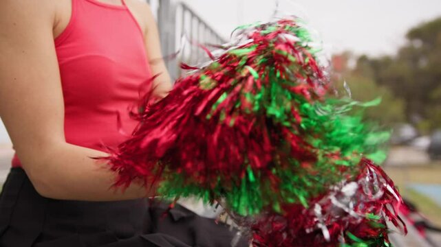 Cheerleader Girl Cheers Her Heart Team With Pompon In Football Stadium