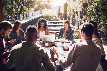 Holding hands, business and group with prayer for food, finance planning and budget documents of teamwork. Staff, thanks and meeting with paperwork, graphs and profit worship for accounting at cafe