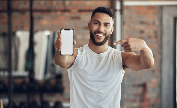 Phone screen, smile and portrait of man in gym for exercise app, membership and software download. Person, point and tech with mockup space for fitness program, training and online registration info