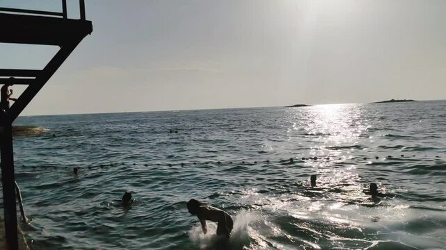 Man jumps in the water for fun