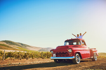 Fototapeta premium Freedom, car and children on road trip in countryside with fun for adventure, journey or holiday. Excited, cheering and boy kids driving in vehicle with travel for vacation, weekend or getaway.