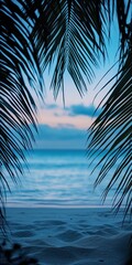 Fototapeta premium Beautiful beach background framed by palm trees at twilght