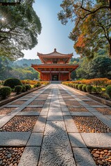 Fototapeta premium A beautiful and serene traditional Asian temple surrounded by lush greenery and trees, with a detailed pathway leading to the entrance