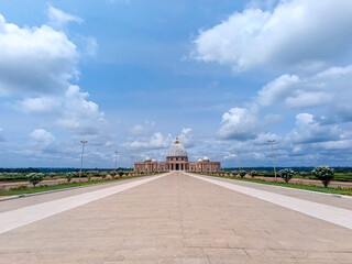 view of the Basilica of Our Lady of Peace in Yamoussoukro under a blue sky, Ivory Coast