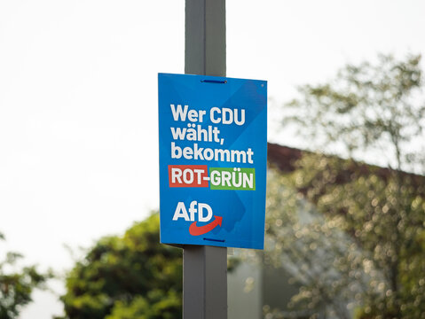 DRESDEN, GERMANY - 21. August 2024: AfD election campaign poster with the slogan "Wer CDU w&auml;hlt, bekommt ROT-GR&Uuml;N" (who votes for the CDU gets red-green) in East Germany for the Landtagswahl.