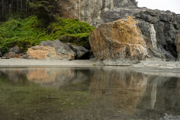 Tidal Pool At The Base Of Large Rocks On the Coastal Trail At Low Tide