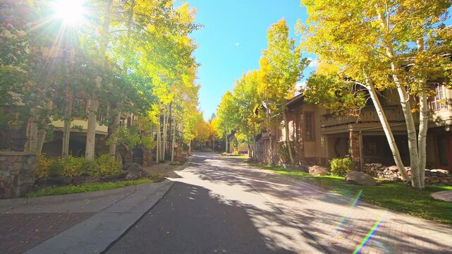 Vail, Colorado city ski resort town in autumn, colorful fall pov point of view walking on road in residential house home area