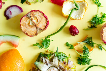 a variety of fruits and vegetables food waste on-a-yellow surface
